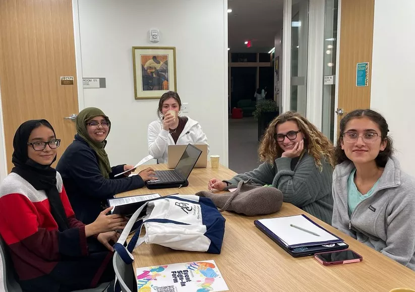 Image of students studying in The Well Kitchen at the Breaking Barriers Owl Night Study Night