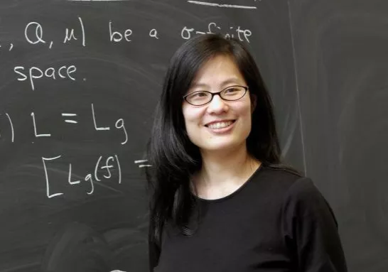 Leslie Cheng teaching at the chalkboard