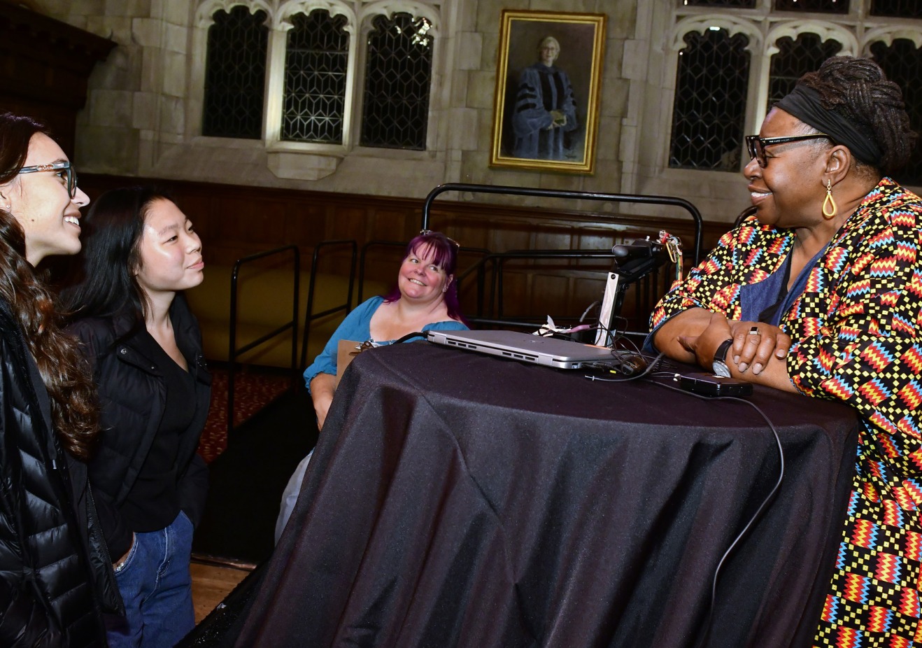 students talking with speaker Loretta Ross