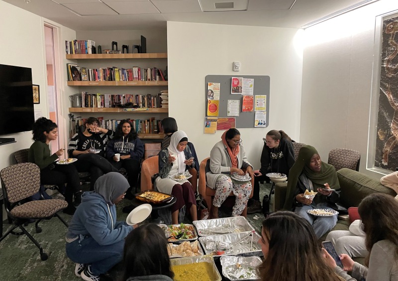 Students enjoying halal food in the Multicultural living room at The Well