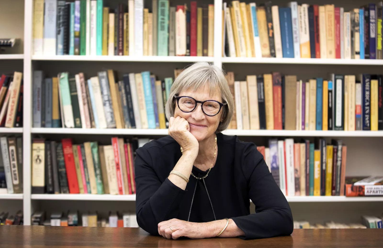 Drew Gilpin Faust with a bookshelf in the background