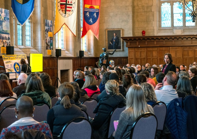 faculty and staff gathered in Great Hall