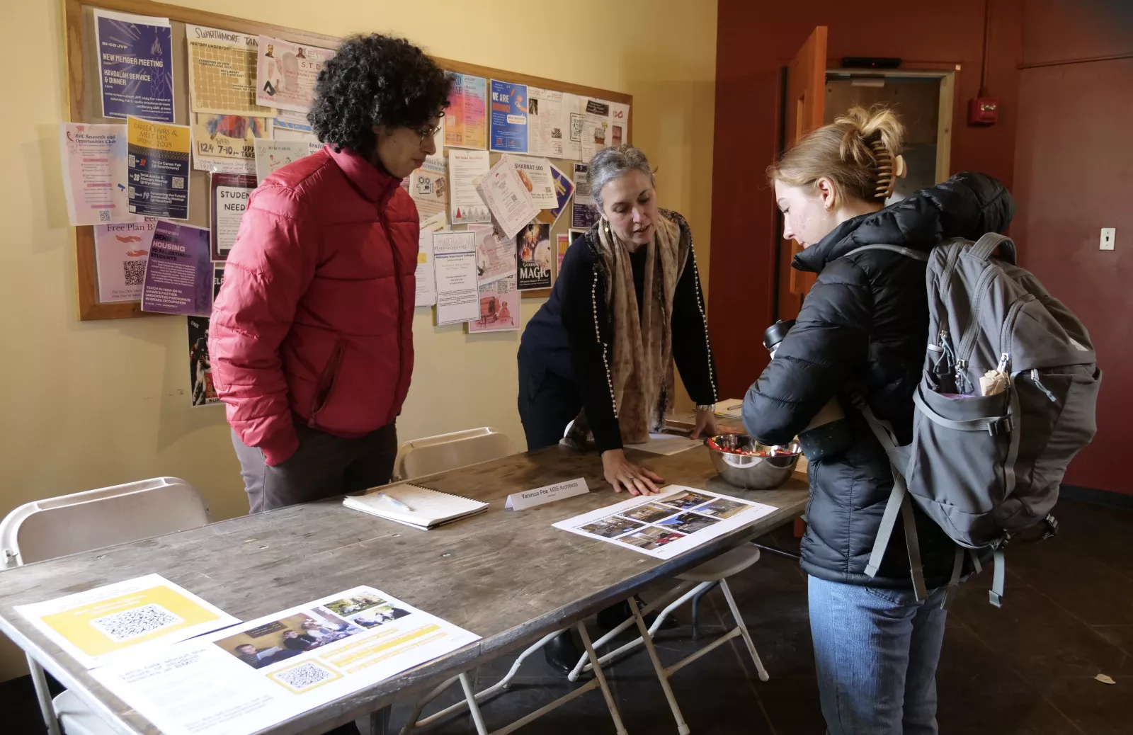 student talks with representatives from MBB