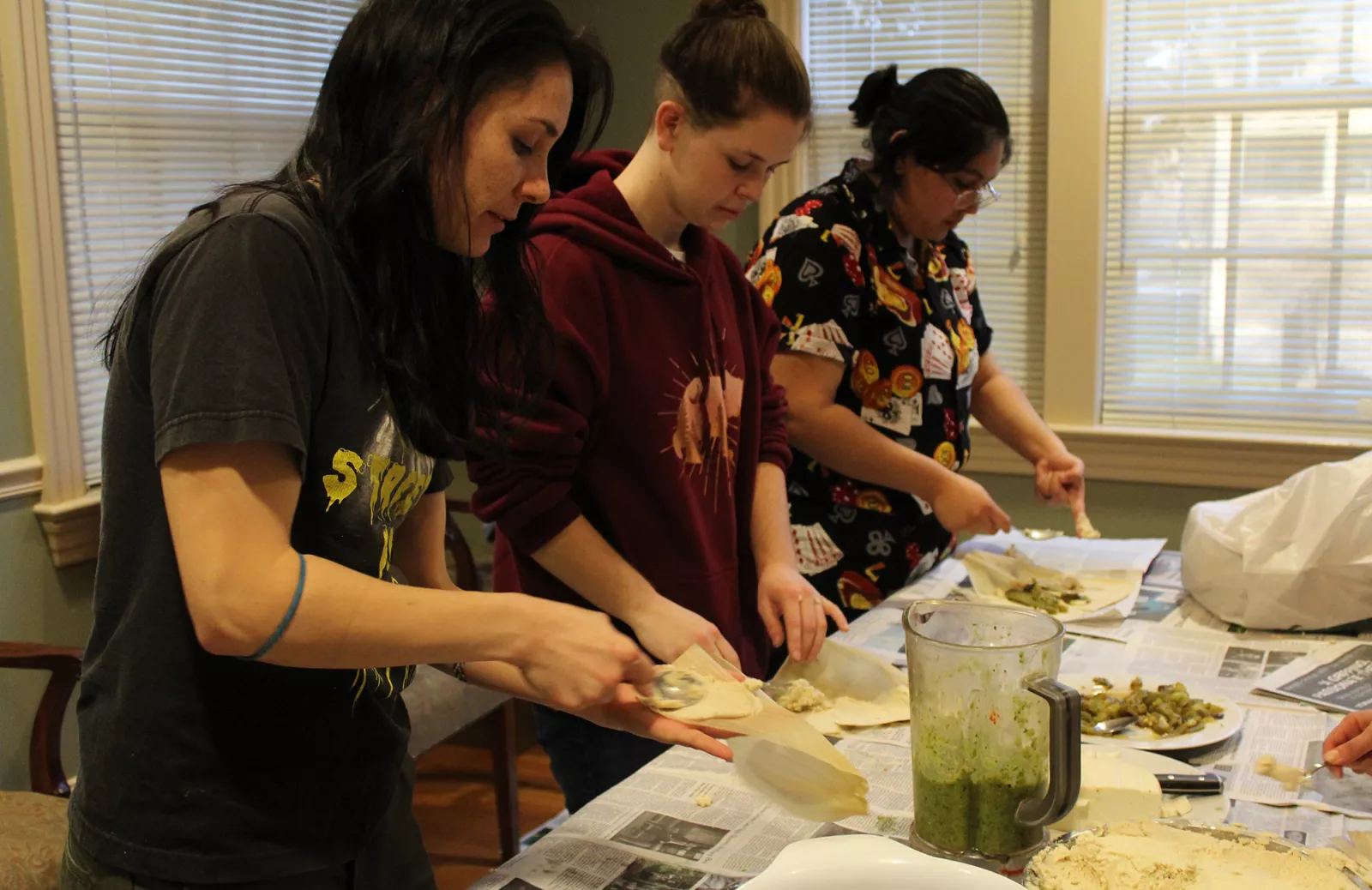 Migrations 360° students put together tamales in the SGA kitchen.