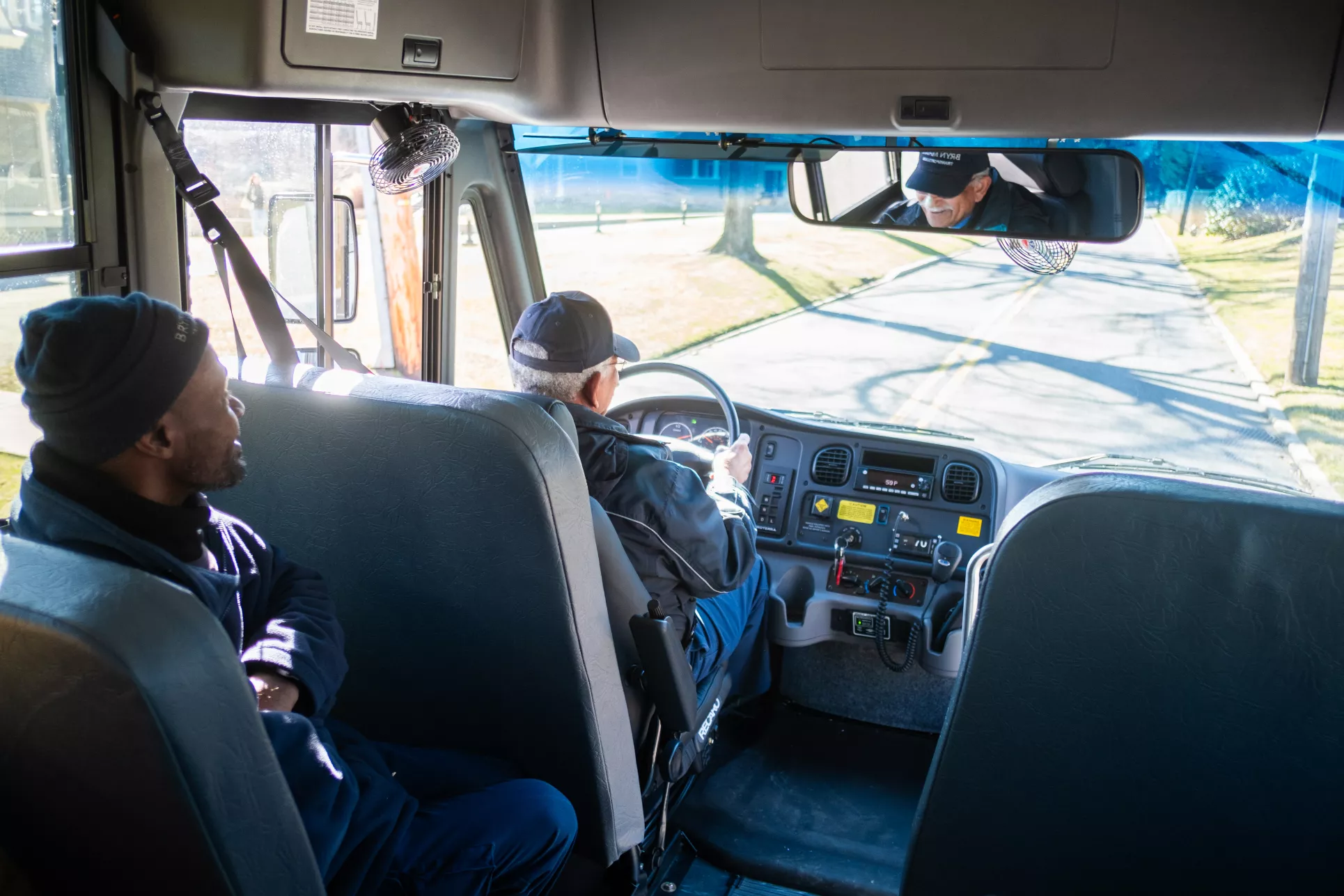 A view of the driver inside the bus.