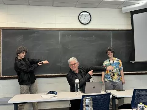 Victor Donnay and two students during Dress Up as Your Favorite Mathematician