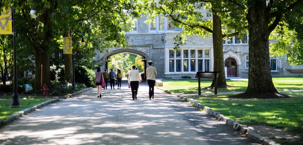 Landscape photo with students walking on path