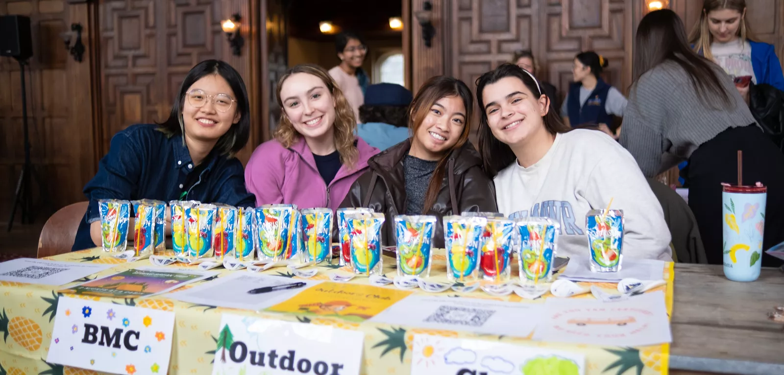 Four students advertising outdoor club