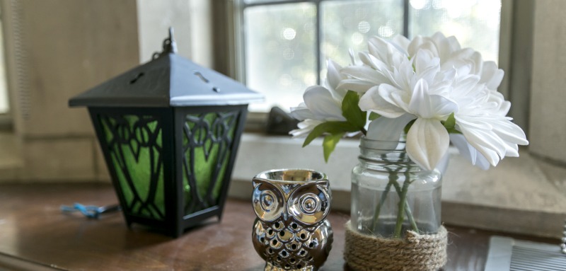 Dorm Decor including a lantern, owl, and flowers