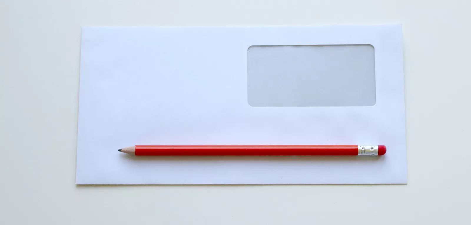 business envelope and pencil