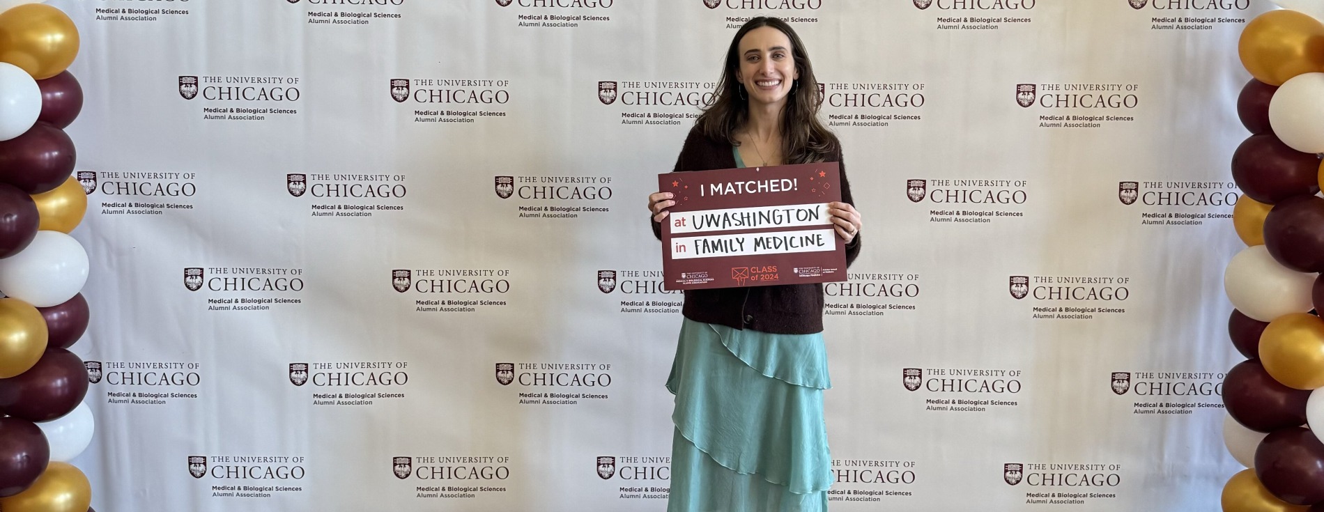 Young woman holding sign that reads I Matched