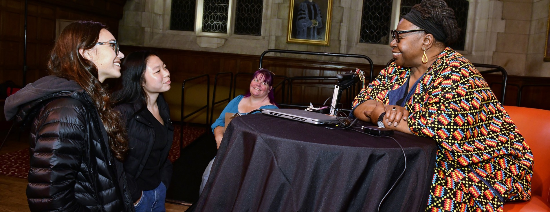 students talking with speaker Loretta Ross