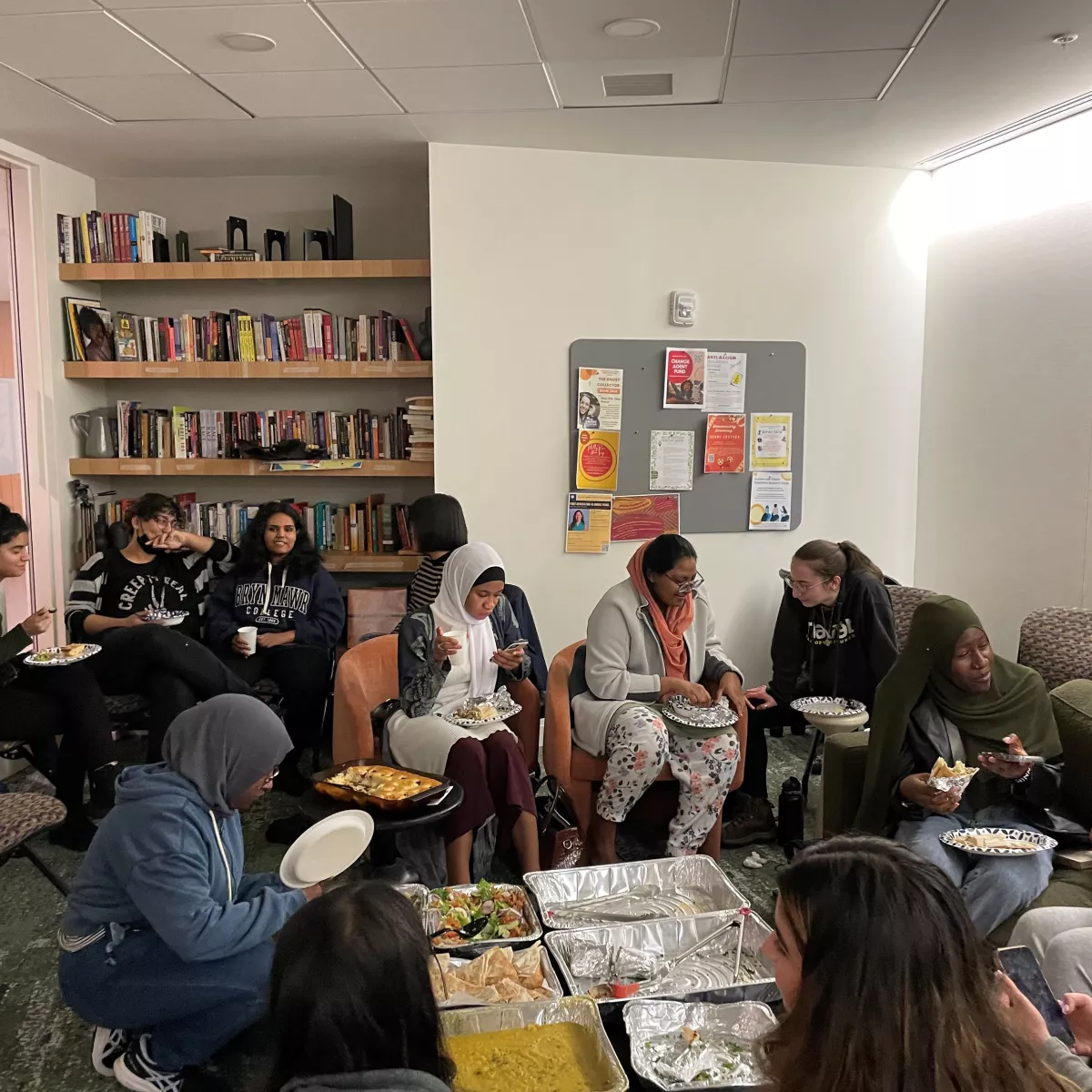 Students enjoying halal food in the Multicultural living room at The Well