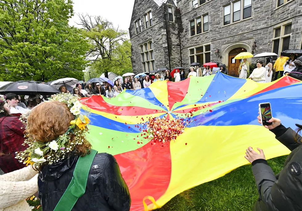 Flowers are tossed in the air using a parachute on May Day