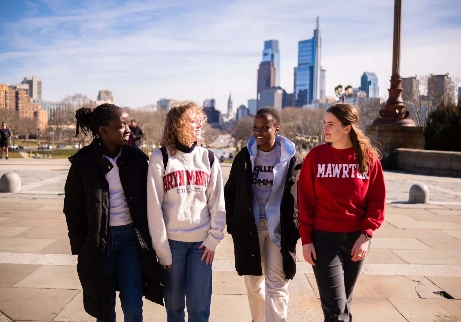 Four students walking up the "Rocky Steps" at the Philadelphia Museum of Art