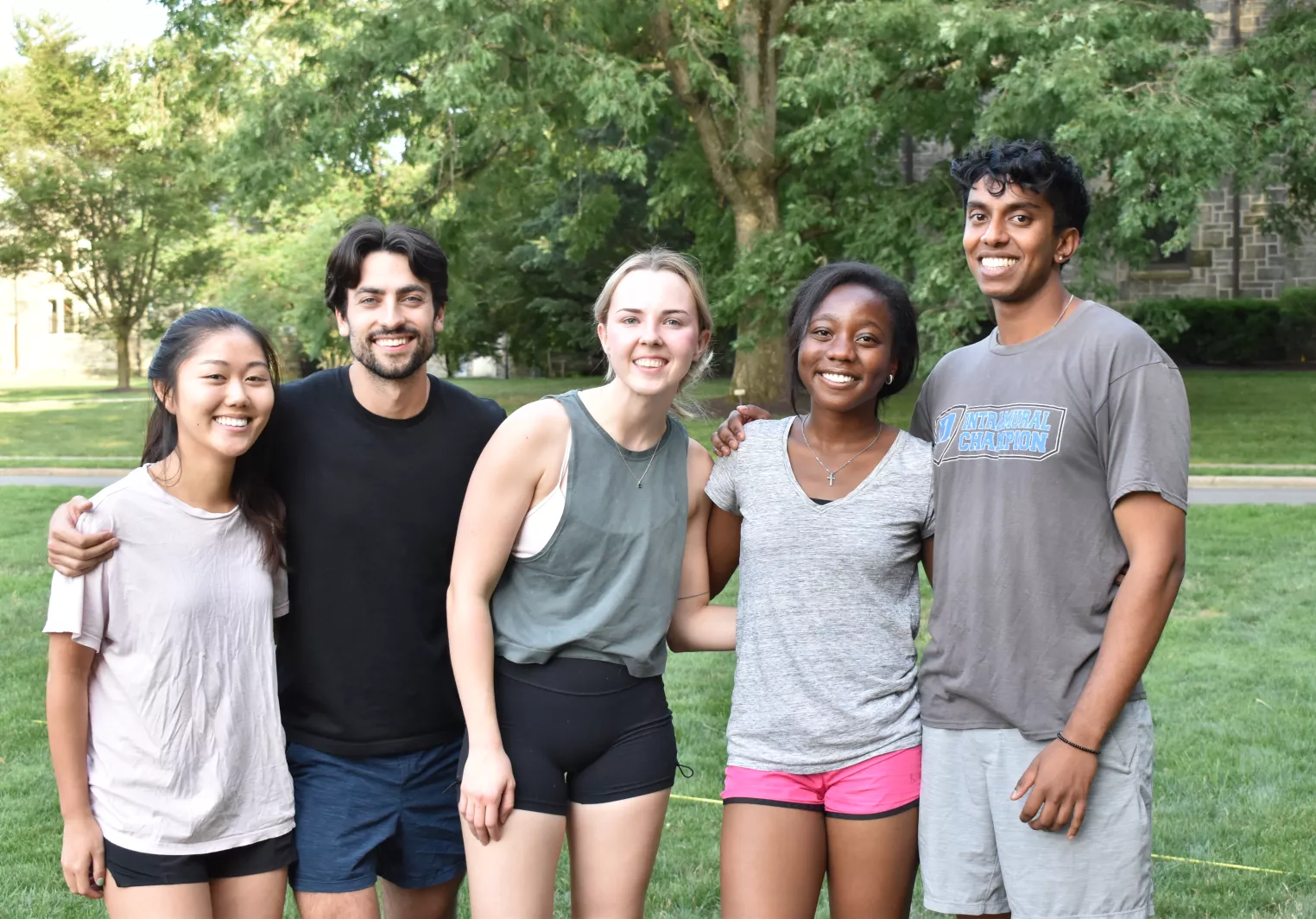 Group of students smiling and standing