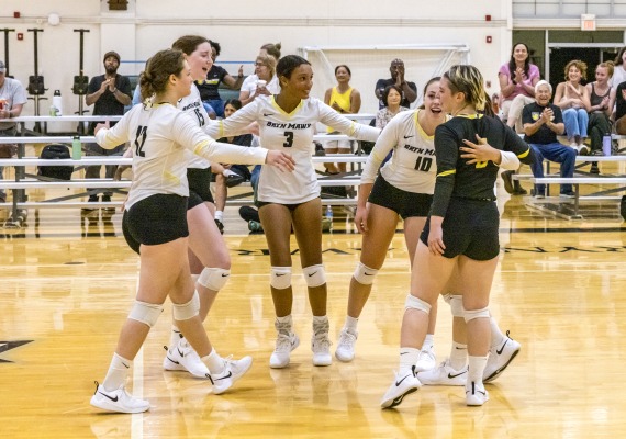 student athletes on a wooden court