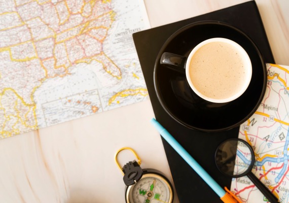 coffee cup with maps for travel