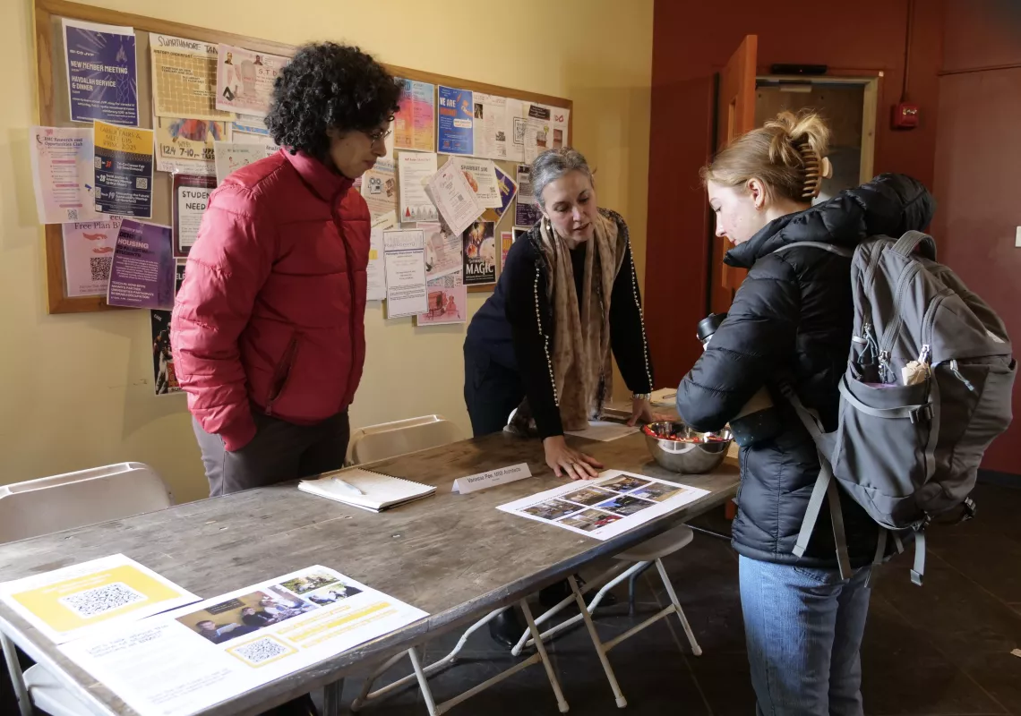 student talks with representatives from MBB