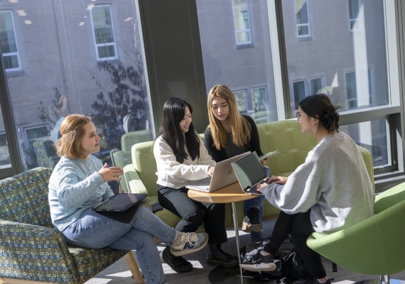 students sitting in park