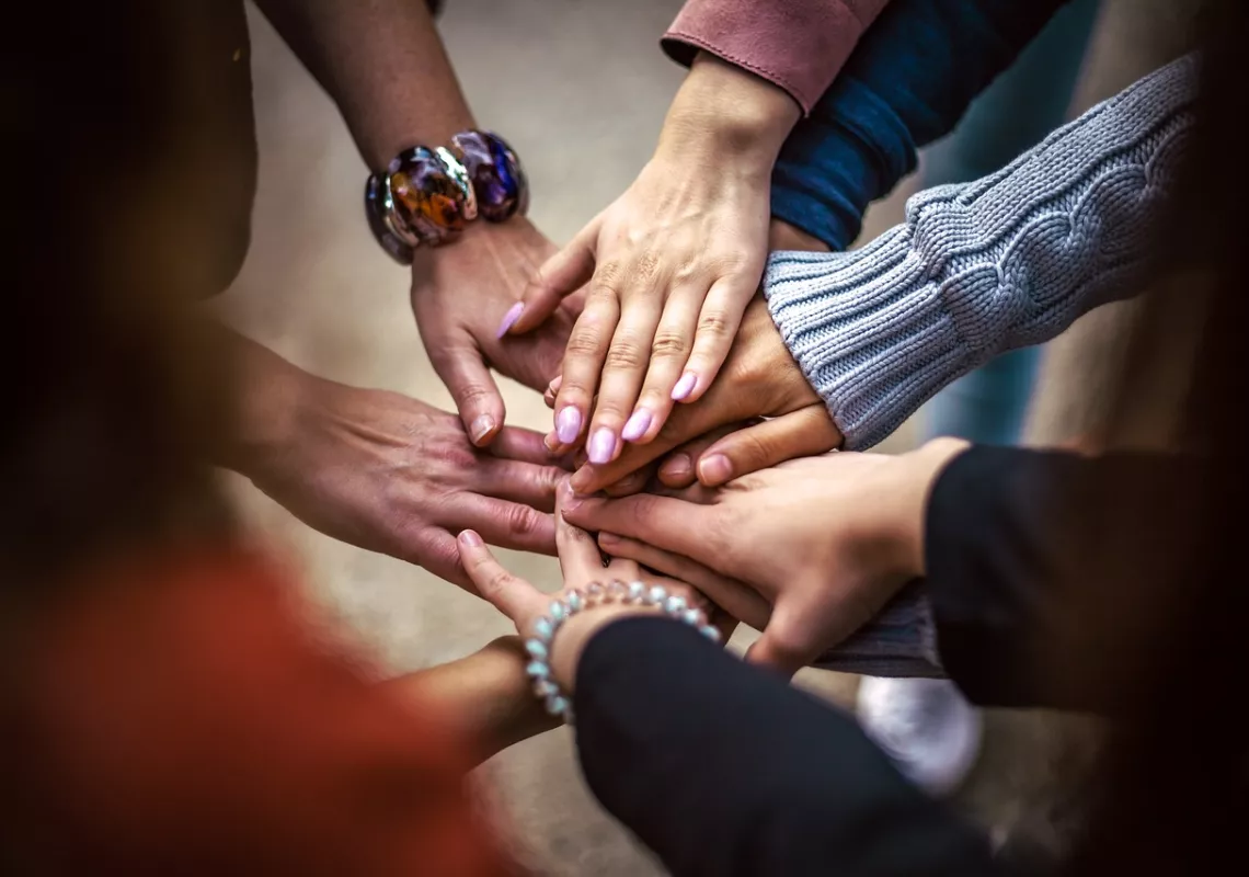 Group of hands in a circle