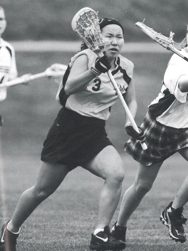 Jenny (Yuh) Lo ’01 playing lacrosse in the 2001 yearbook.