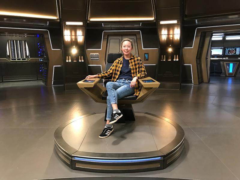 Bo Yeon in the Captain's chair on the set of Star Trek: Discover