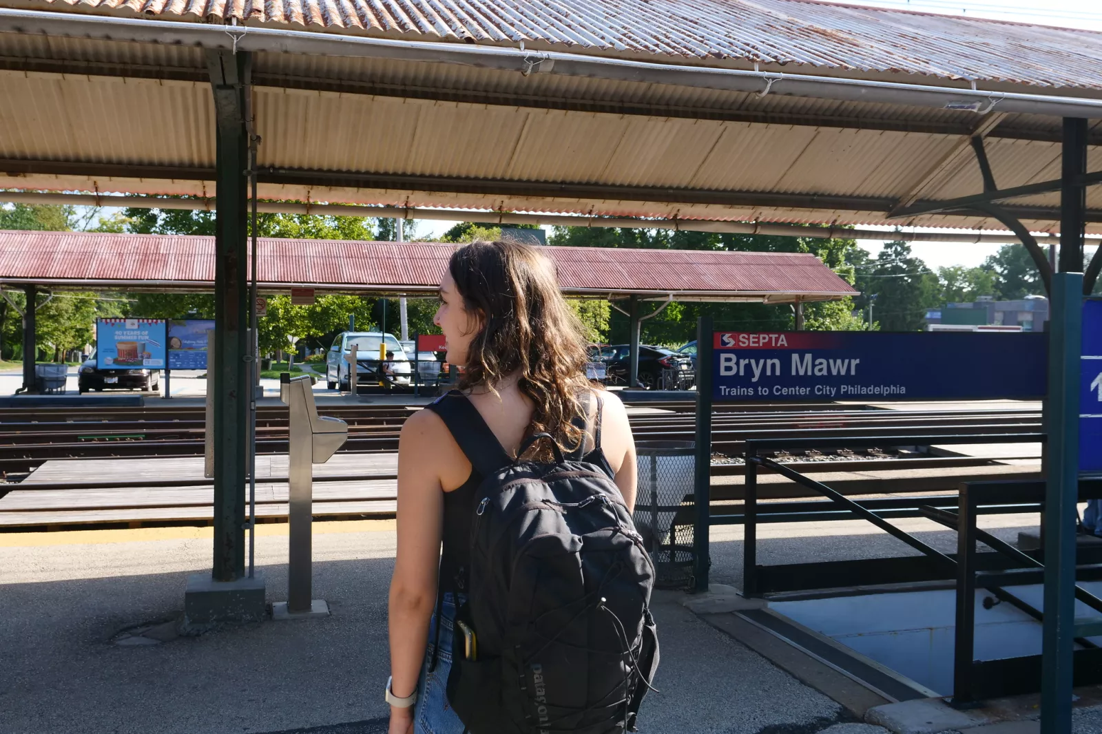 student waits for a train