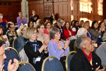 Alums sitting in the audience at cocktail hour