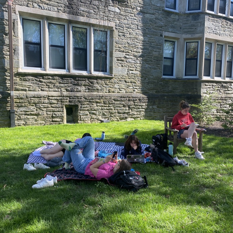 Students doing homework outside