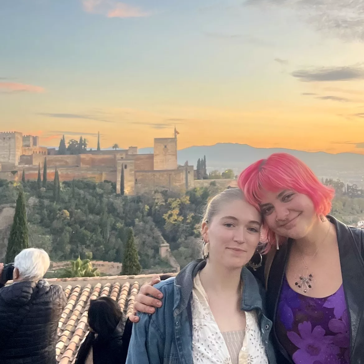 Laurel and friend standing on a hill across from the Alhambra in Granada.