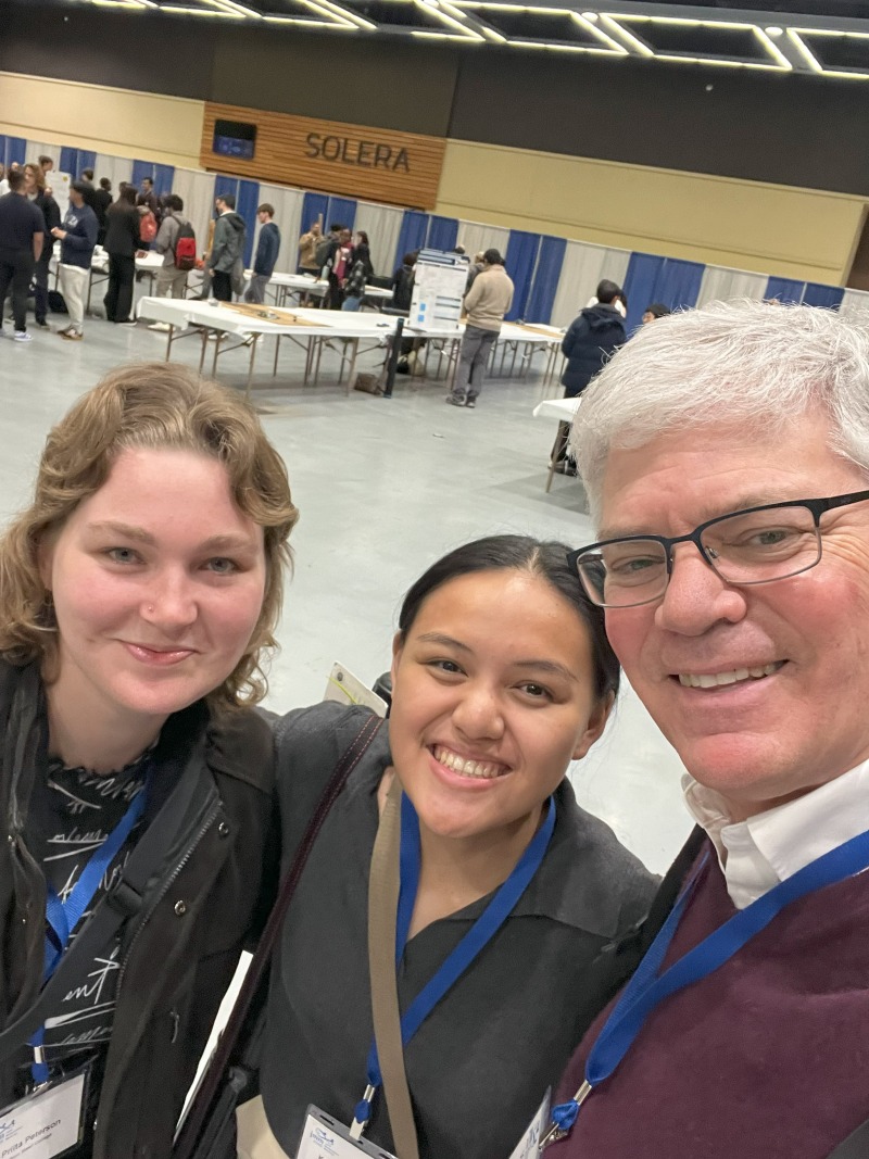 Selfie of Peterson, Pasia, and Donnay at the JMM poster session