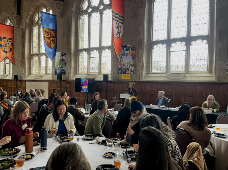 Wide shot of Great Hall filled with people attending the lecture